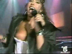 Italian popstar sings and her big tit pops out