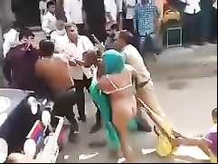 Street fight with a naked female ass
