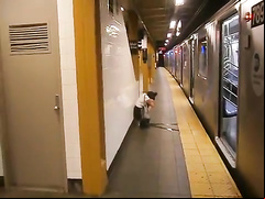 Drunk coed relieves herself at a metro station