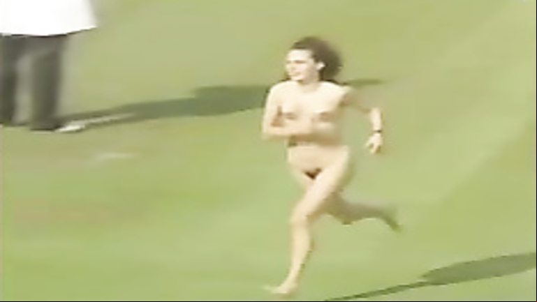 Female streaker runs across the stadium